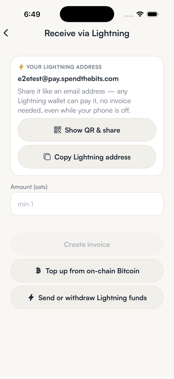 The Receive via Lightning screen in SpendTheBits with an amount field and a Create invoice button